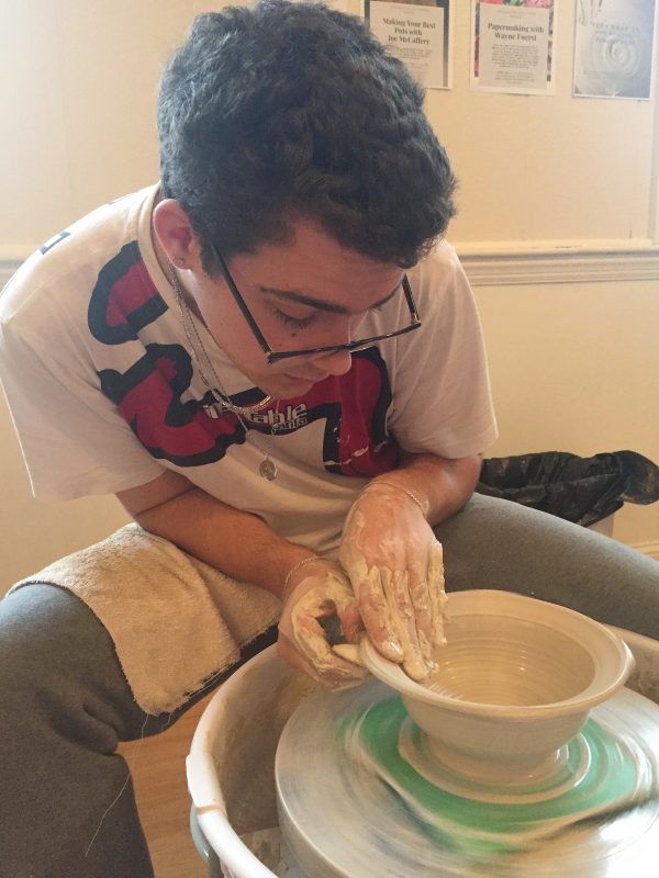 Abe throwing on the wheel