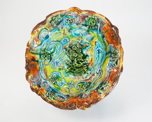 richly decorated platter in rainbow hues